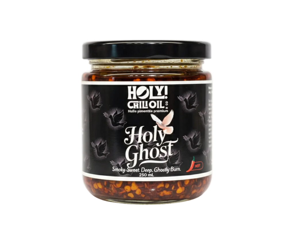 A jar of Holy Ghost Chili Oil by HOLY! Chili Oil & Co., a hot but not as much heat as it leads onto: featuring the Ghost Pepper (Bhut Jolokia) blended with Ancho pepper for a balanced heat. 